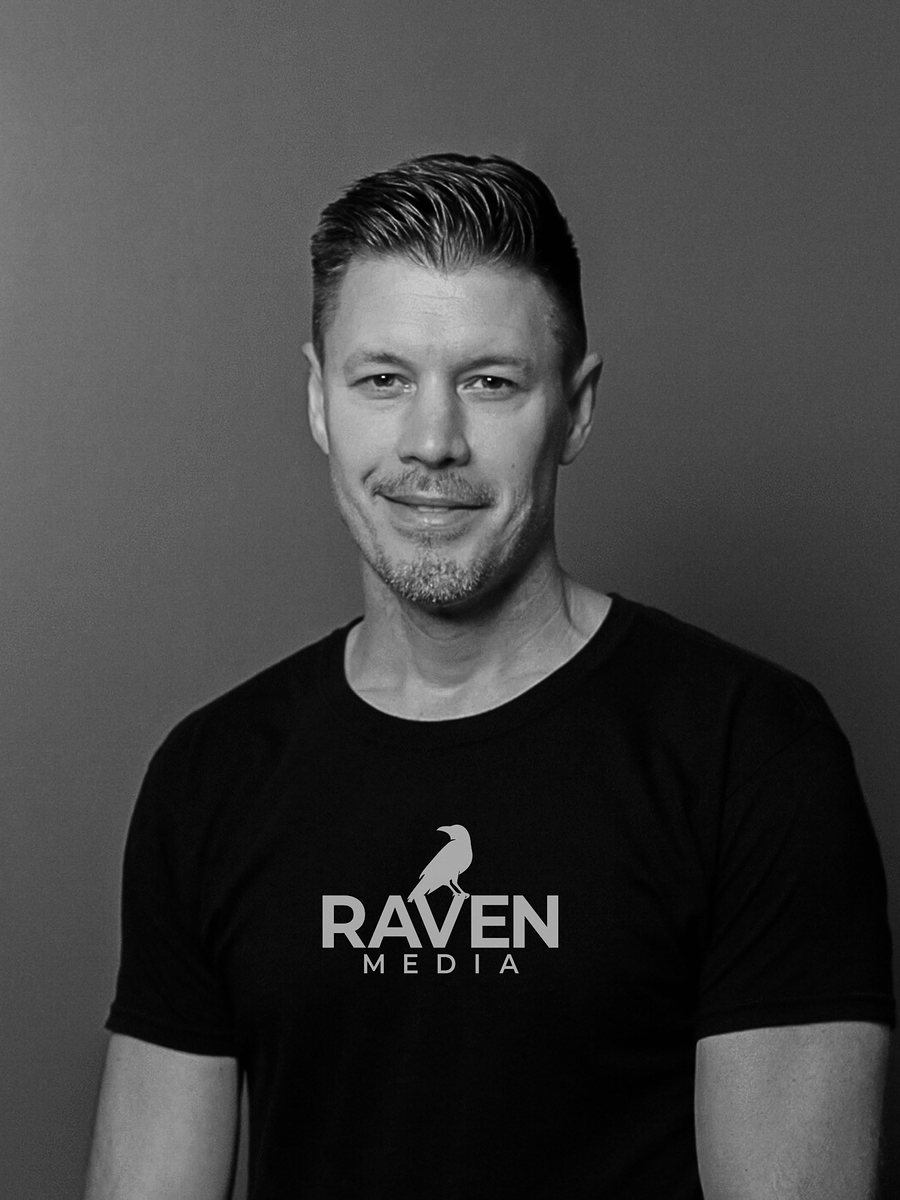 Peter Fowler in a black Raven Media t-shirt.