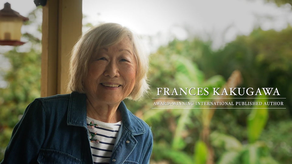Frances Kakugawa seated on a bench by the water.