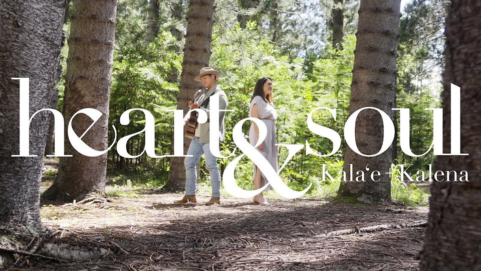 A man and a woman standing together outdoors.